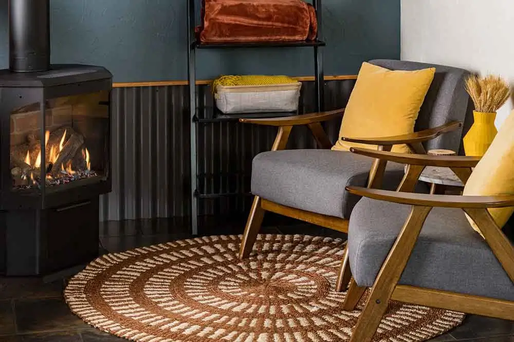 cozy living room area with two gray armchairs