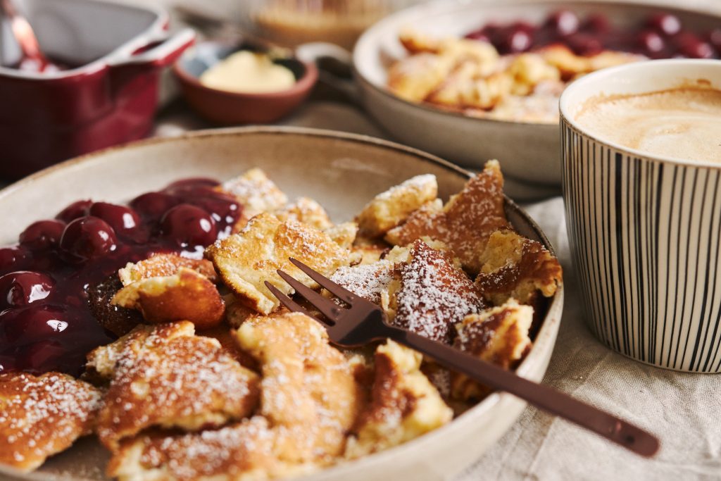 view-delicious-fluffy-pancakes-with-cherry-powdered-sugar